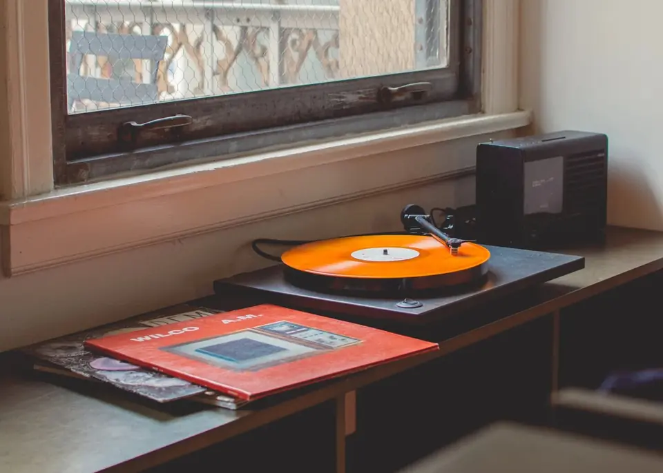 Record player and speaker by a window
